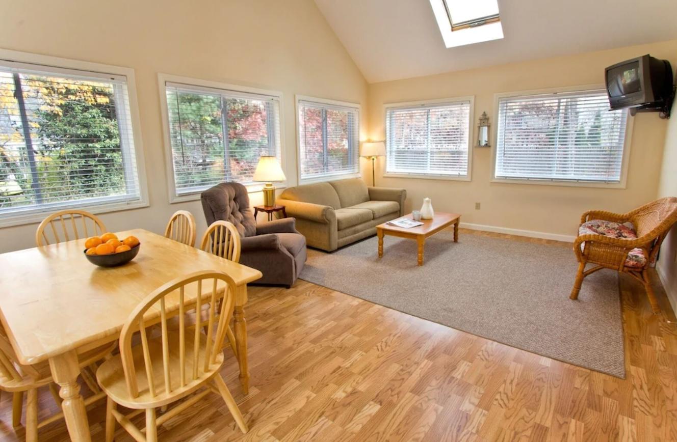 15 Nehoiden Road Mashpee, MA 02649 - Photo 13 of 40 a living room with furniture and two large window