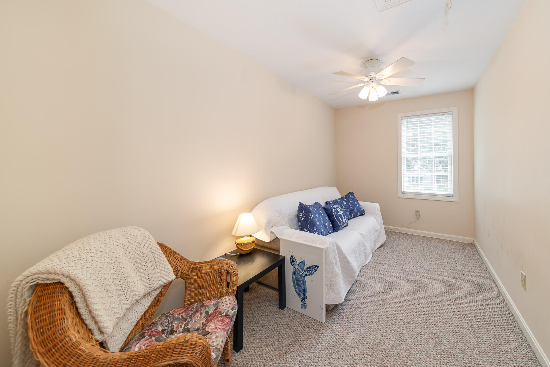 15 Nehoiden Road Mashpee, MA 02649 - Photo 21 of 40 a living room with furniture and a chandelier