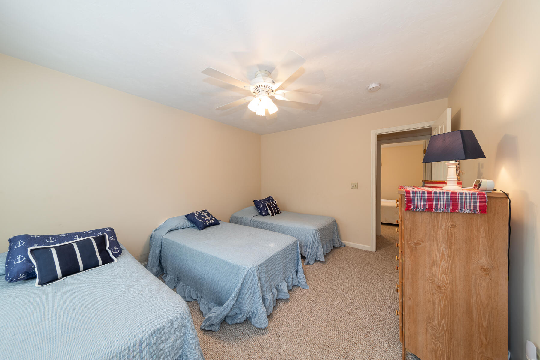 15 Nehoiden Road Mashpee, MA 02649 - Photo 24 of 40 a bedroom with two beds and a chandelier