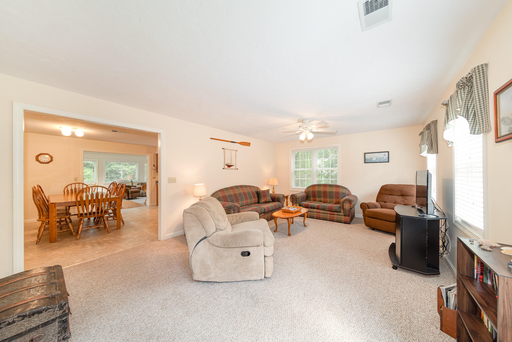 15 Nehoiden Road Mashpee, MA 02649 - Photo 31 of 40 a living room with furniture and a flat screen tv