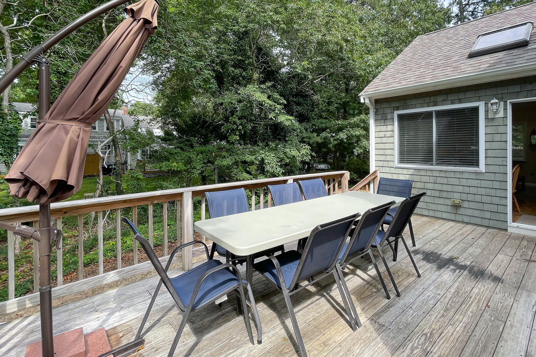 15 Nehoiden Road Mashpee, MA 02649 - Photo 34 of 40 a balcony with wooden floor table and chairs