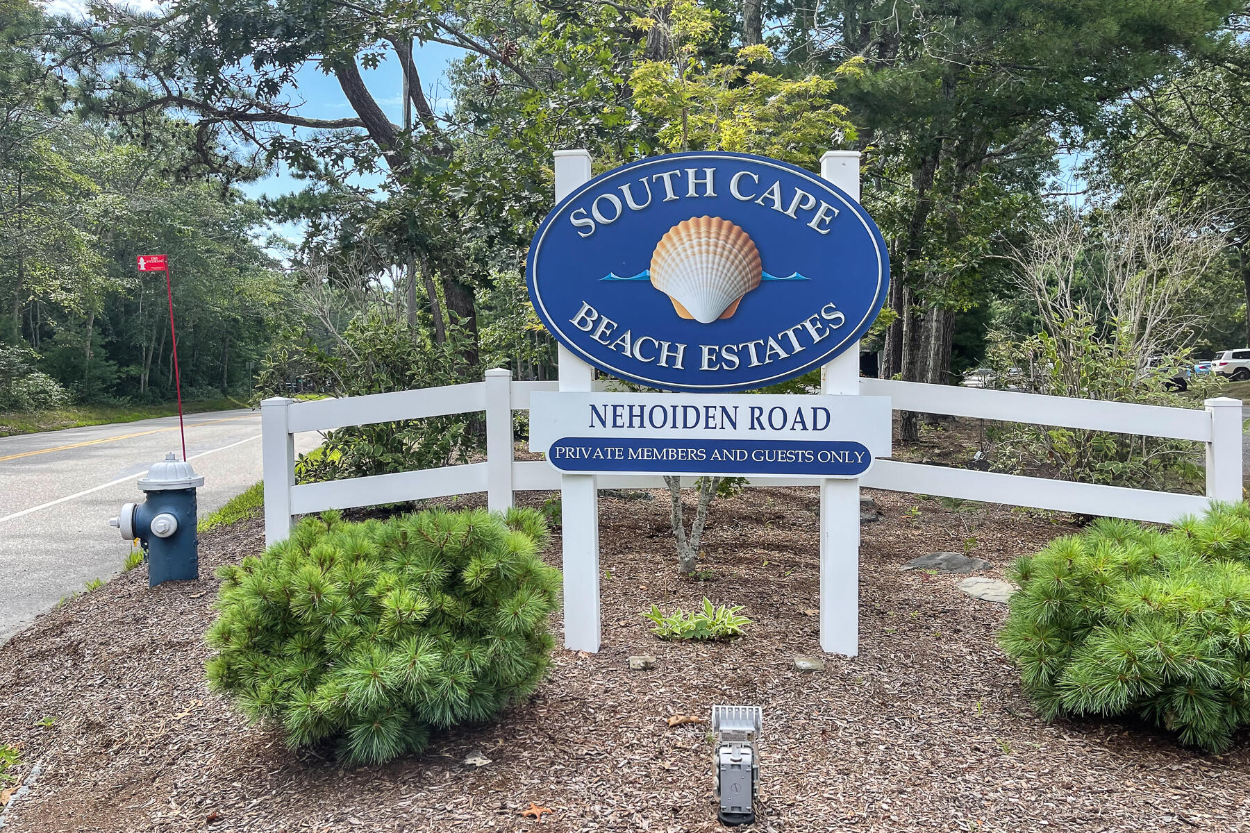 15 Nehoiden Road Mashpee, MA 02649 - Photo 7 of 40 a view of outdoor space with signage and flags