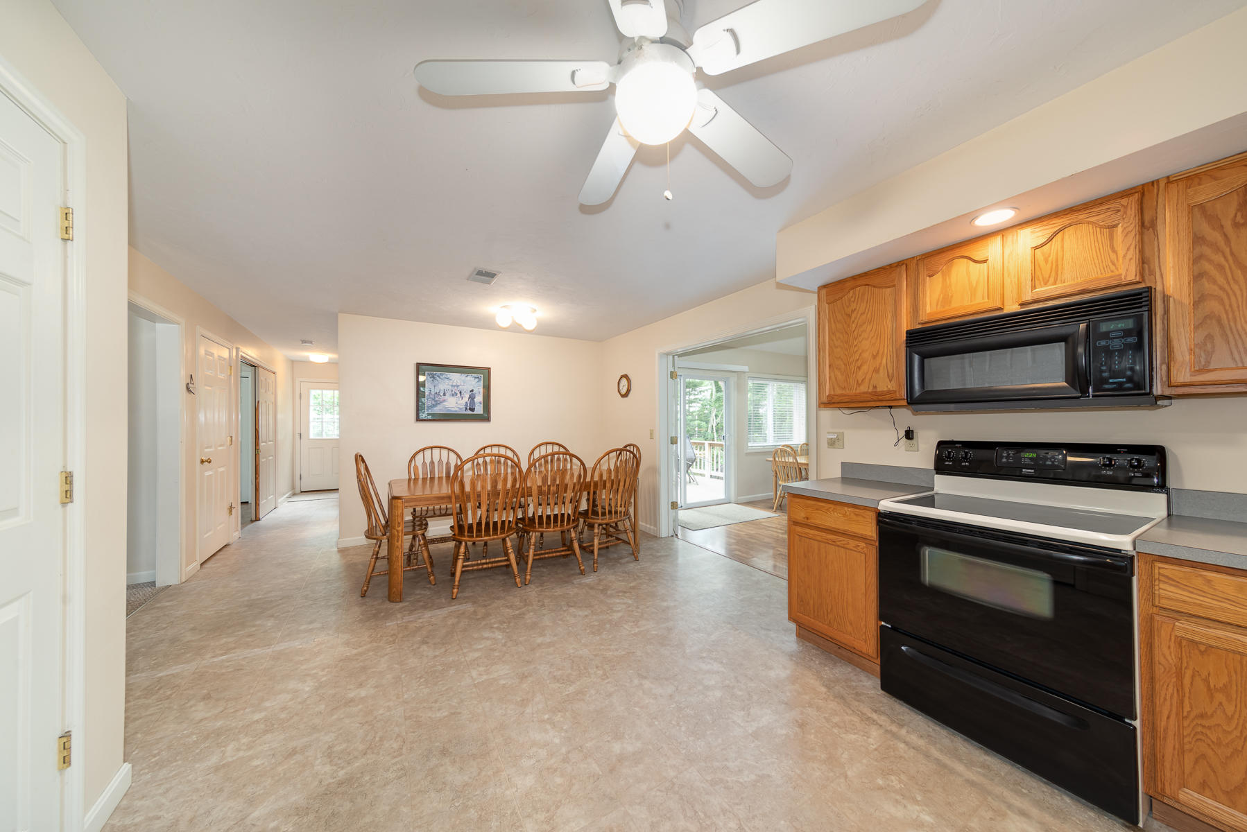 15 Nehoiden Road Mashpee, MA 02649 - Photo 10 of 40 a living room with furniture a fireplace and a flat screen tv
