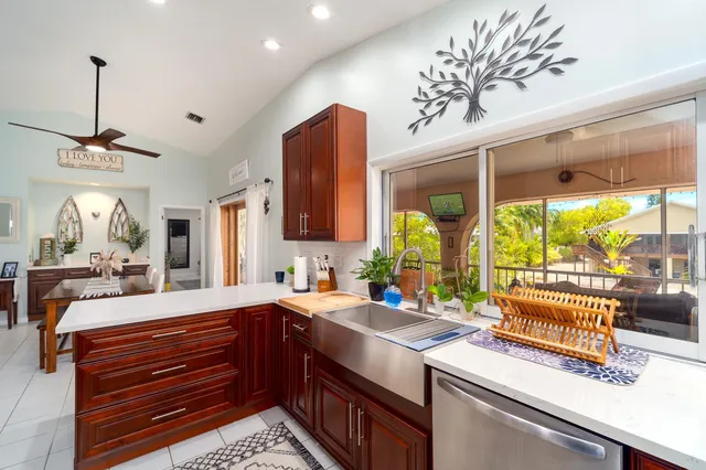 a kitchen with a sink and a large window