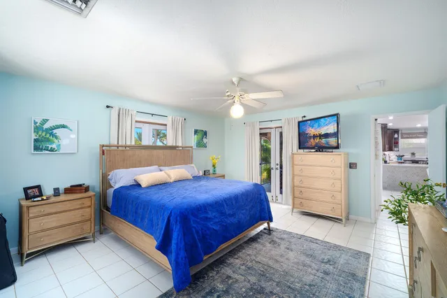 a bedroom with a bed and a cabinets