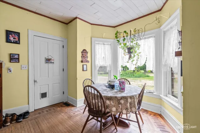 a view of a dining room with furniture window and outside view