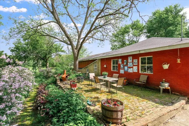a front view of a house with garden view