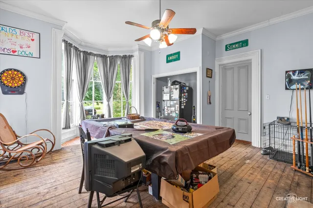 a dining room with furniture and window
