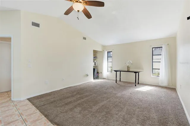 a view of a livingroom with a projector and furniture