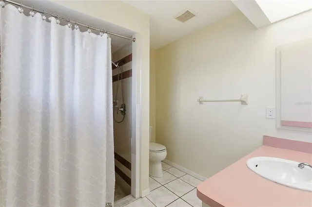 a bathroom with a sink and toilet