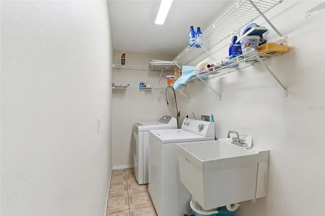 a bathroom with a sink mirror and vanity