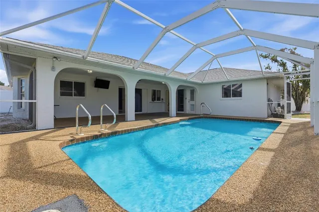 a view of a house with swimming pool