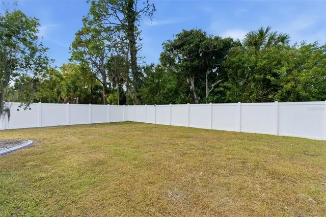 a view of wall with wooden fence