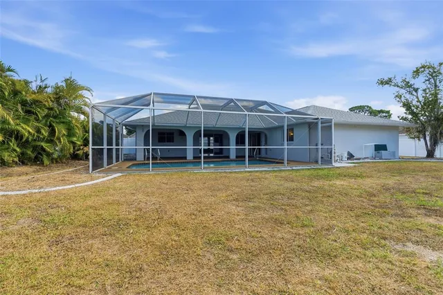 a view of house with a swimming pool