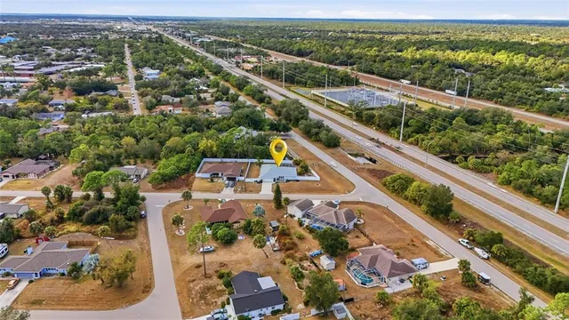 an aerial view of residential houses with outdoor space