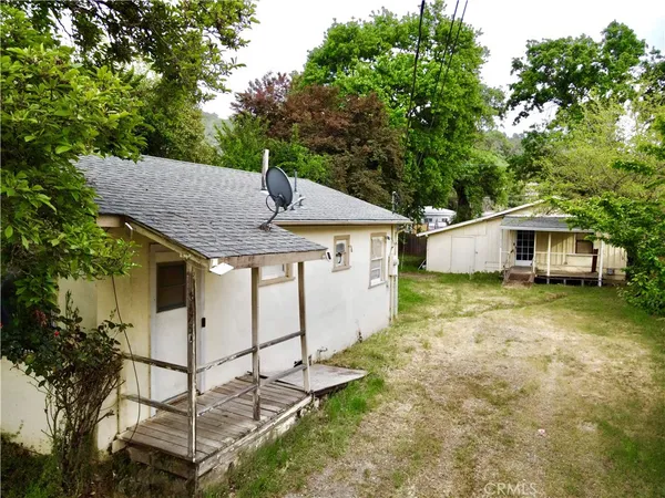 an aerial view of a house with outdoor space