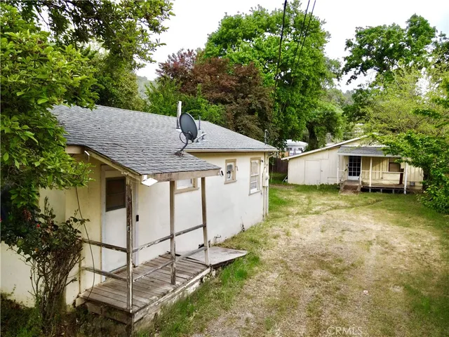 an aerial view of a house with outdoor space