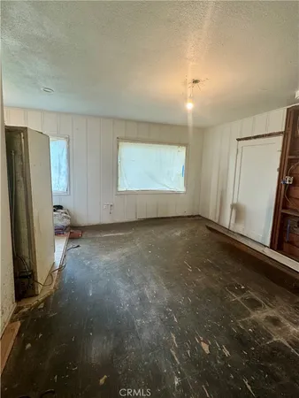 a view of room window and a ceiling fan
