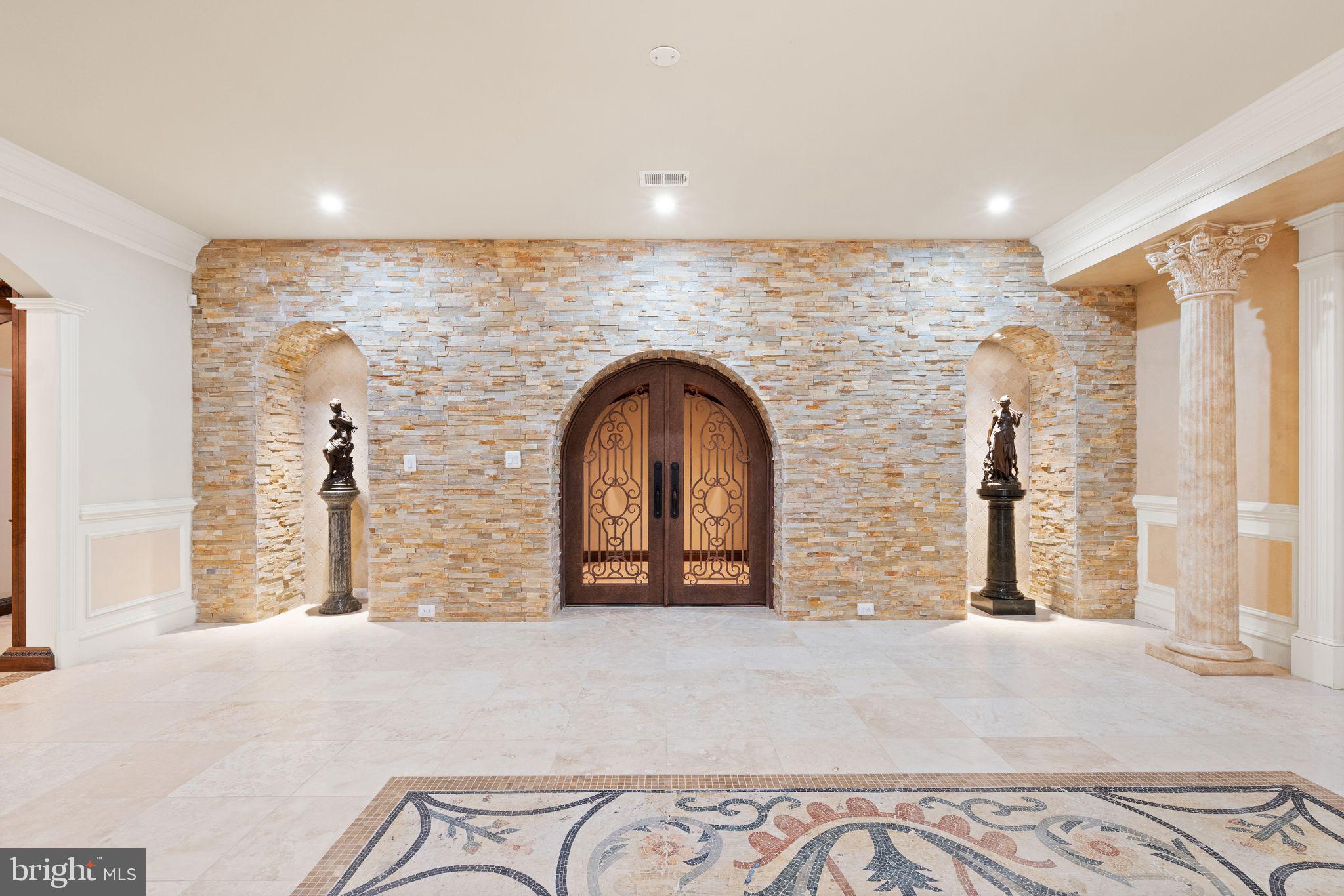 938 Peacock Station Road McLean, VA 22102 - Photo 37 of 50 Dramatic Stacked Stone Wine Cellar w Iron Doors