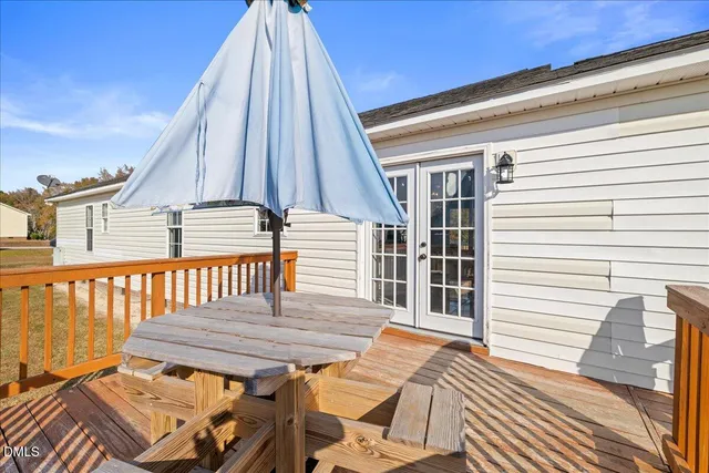 a view of a house with a large tree and big yard