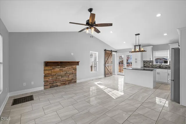 a view of a kitchen with a sink and cabinets