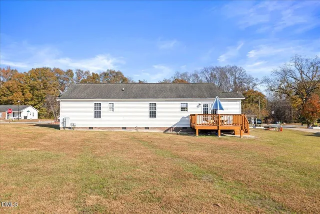 a front view of a house with a yard and a garage