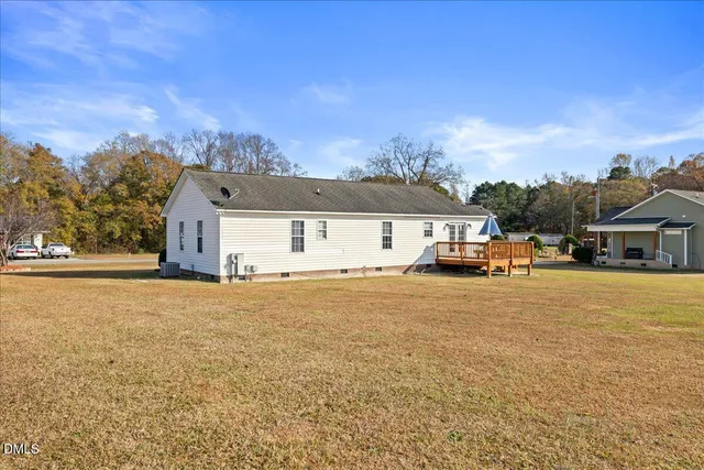 an aerial view of a house with outdoor space