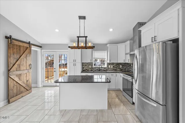 a view of kitchen with stainless steel appliances cabinets and a counter top space
