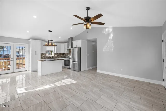 a view of a white house with a swimming pool