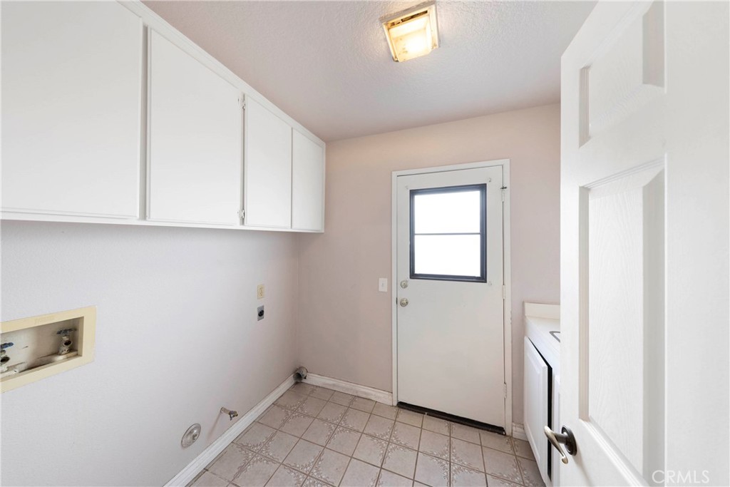 2 Bernini Irvine, CA 92614 - Photo 13 of 30 Individual laundry room with additional storage and utility sink.