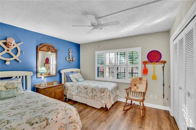 a bedroom with two beds and a window