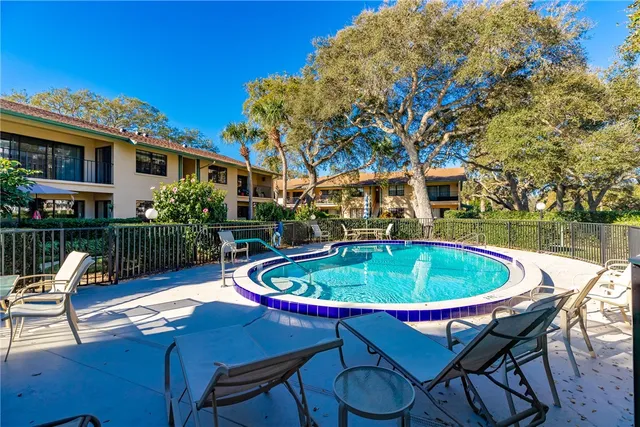 a patio with a table and chairs