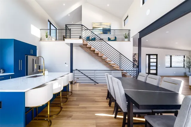 a dining room with furniture and wooden floor