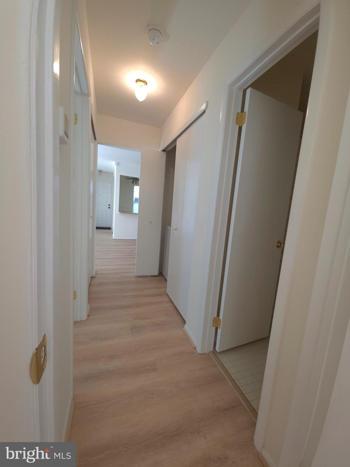 336 A Delancey Place, Unit 336A Mount Laurel, NJ 08054 - Photo 13 of 18 a view of a hallway with wooden floor