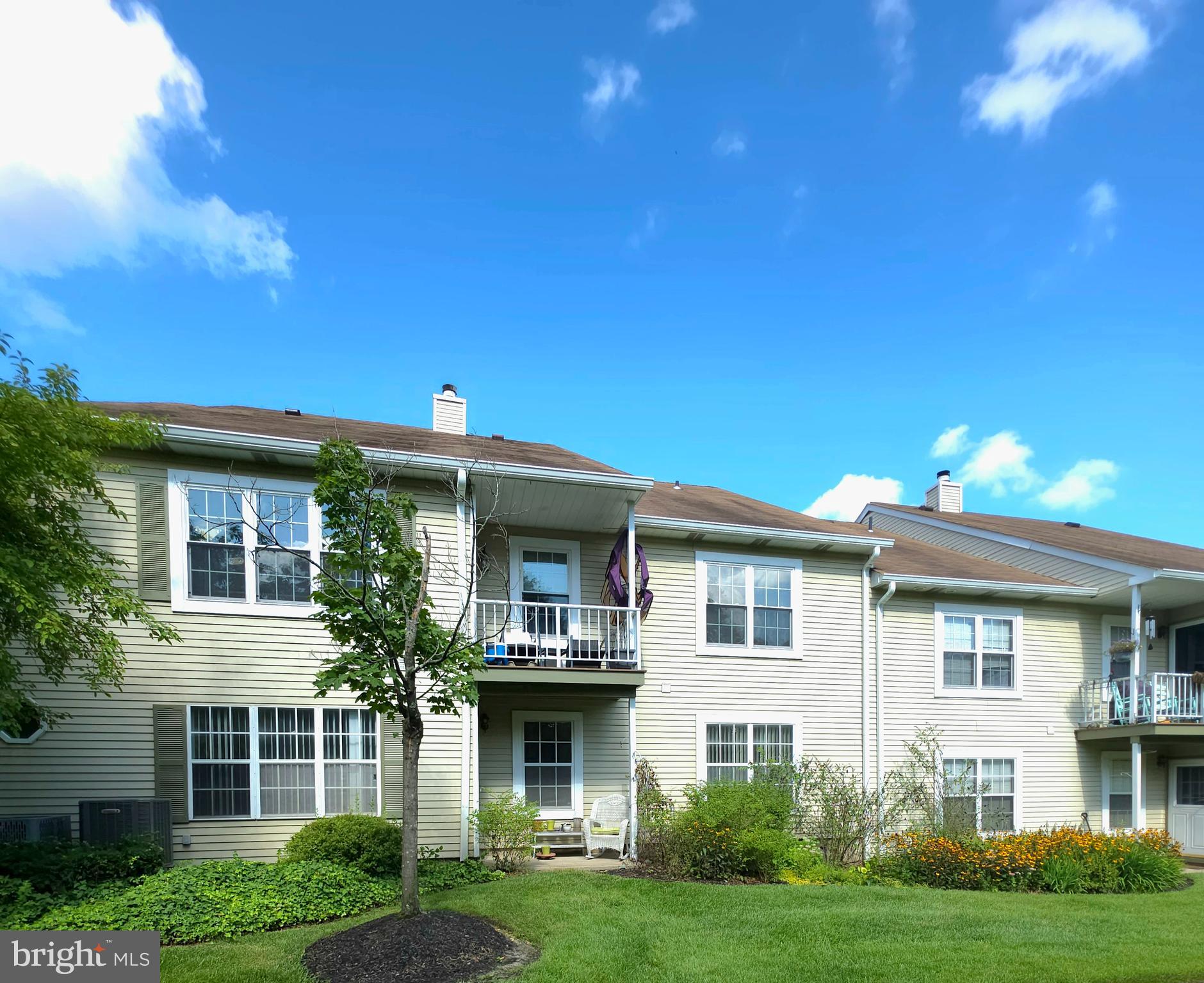 336 A Delancey Place, Unit 336A Mount Laurel, NJ 08054 - Photo 3 of 18 a front view of a house with a yard