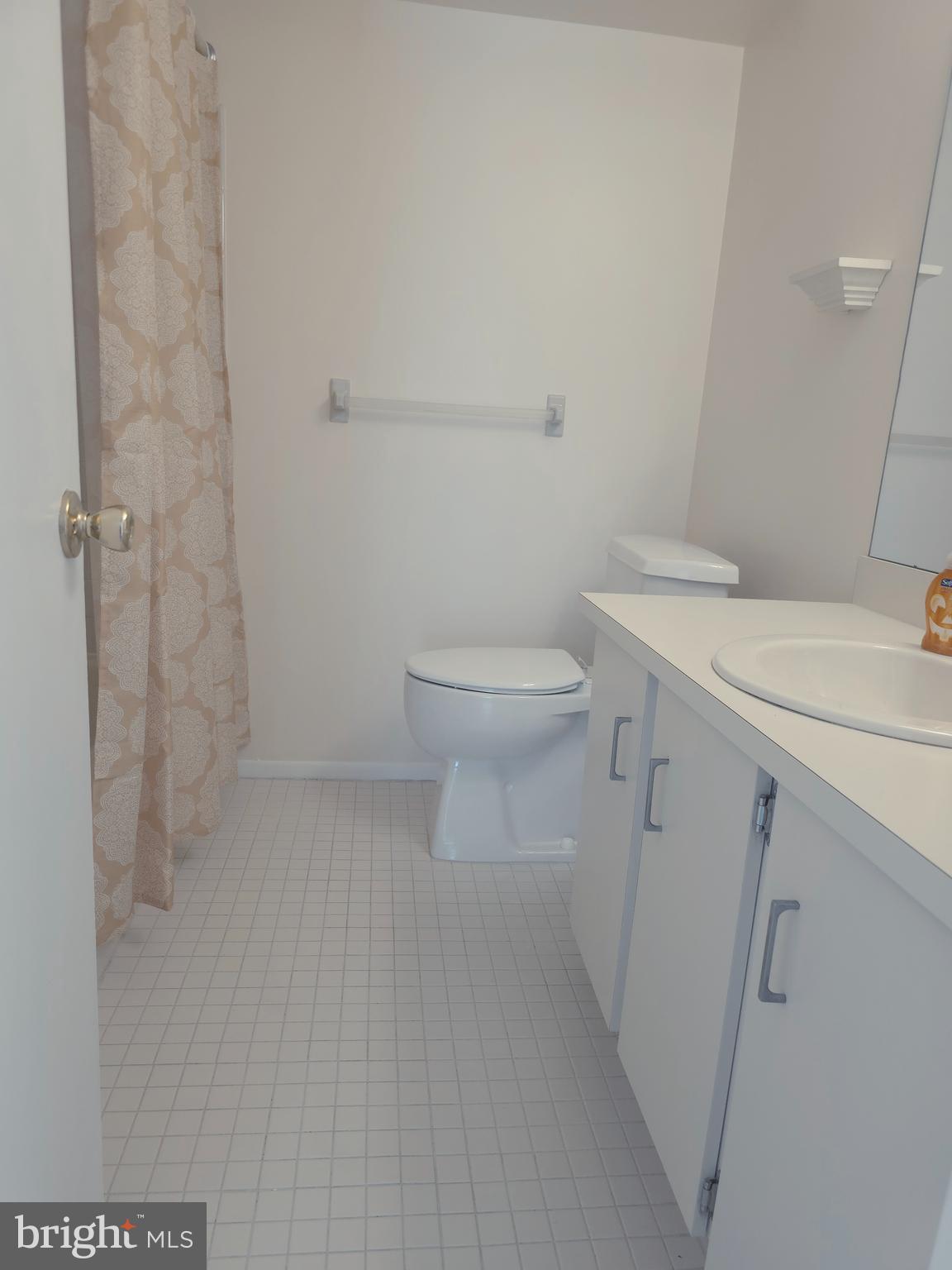 336 A Delancey Place, Unit 336A Mount Laurel, NJ 08054 - Photo 9 of 18 a bathroom with a sink a toilet and shower