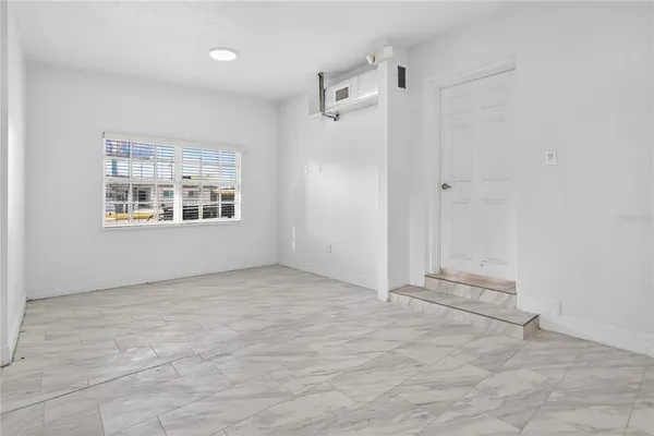 a view of an empty room and window