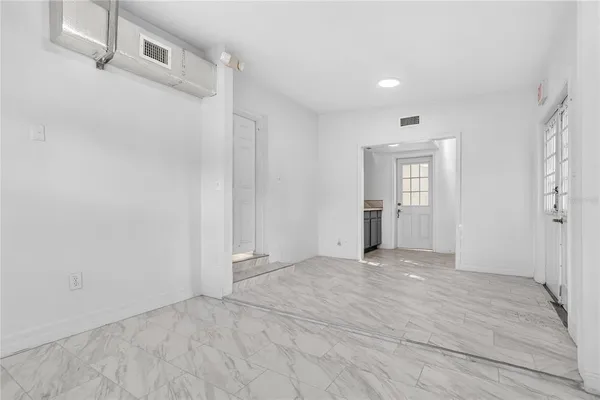 a view of a hallway with paintings on the wall