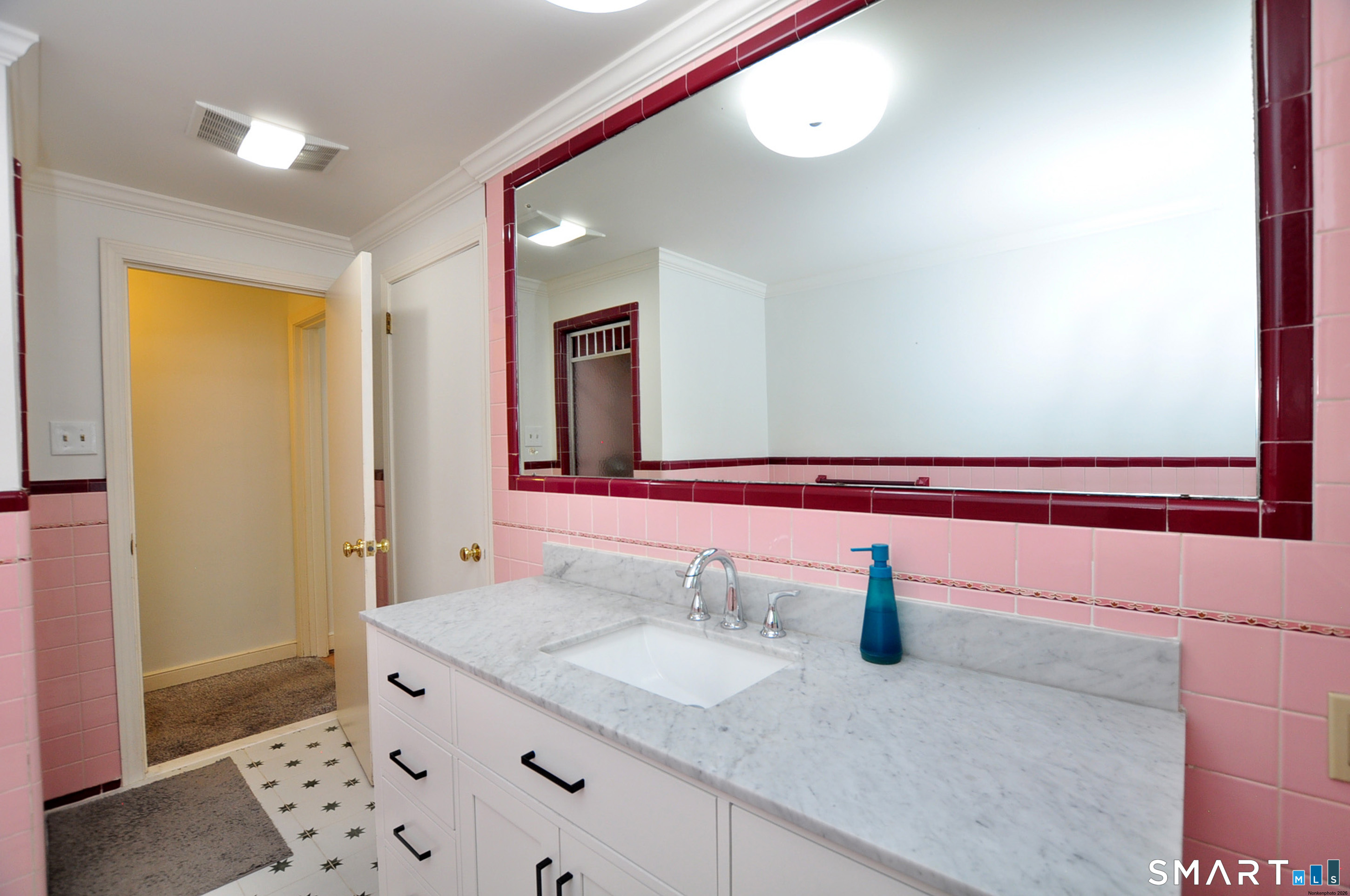 44 Miamis Road West Hartford, CT 06117 - Photo 24 of 39 a bathroom with a granite countertop sink and a mirror