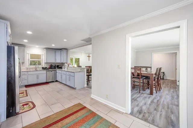 a view of kitchen with cabinets and outdoor living room
