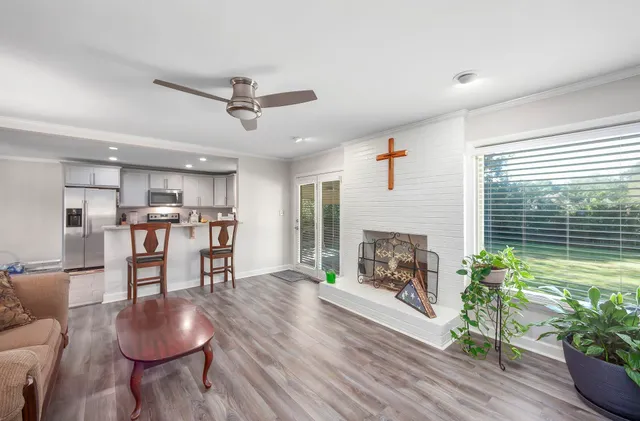 a living room with furniture and a fireplace