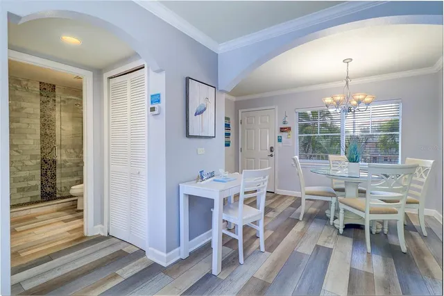 a living room with furniture and a clock
