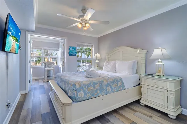 a bed room with a bed window and a mirror