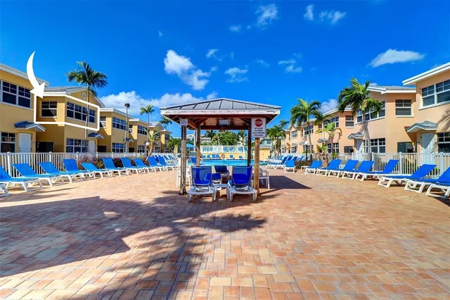 a view of a swimming pool with a table and chairs