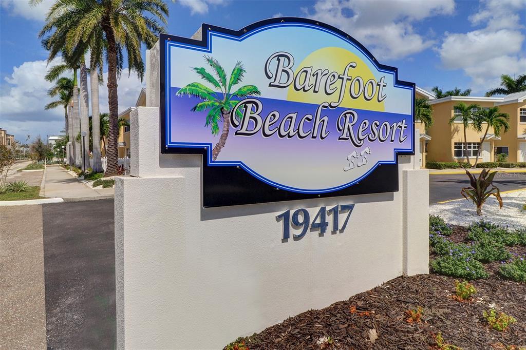 19417 Gulf Boulevard, Unit A202 Indian Shores, FL 33785 - Photo 3 of 35 a sign that is on the wall of building