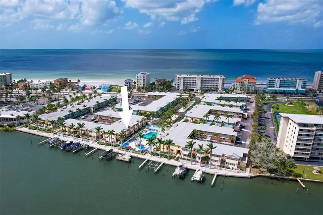 an aerial view of a house with a ocean view