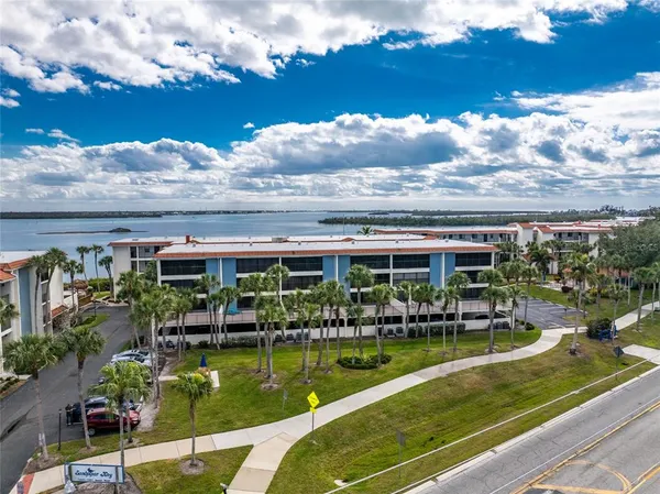 a view of swimming pool with outdoor seating