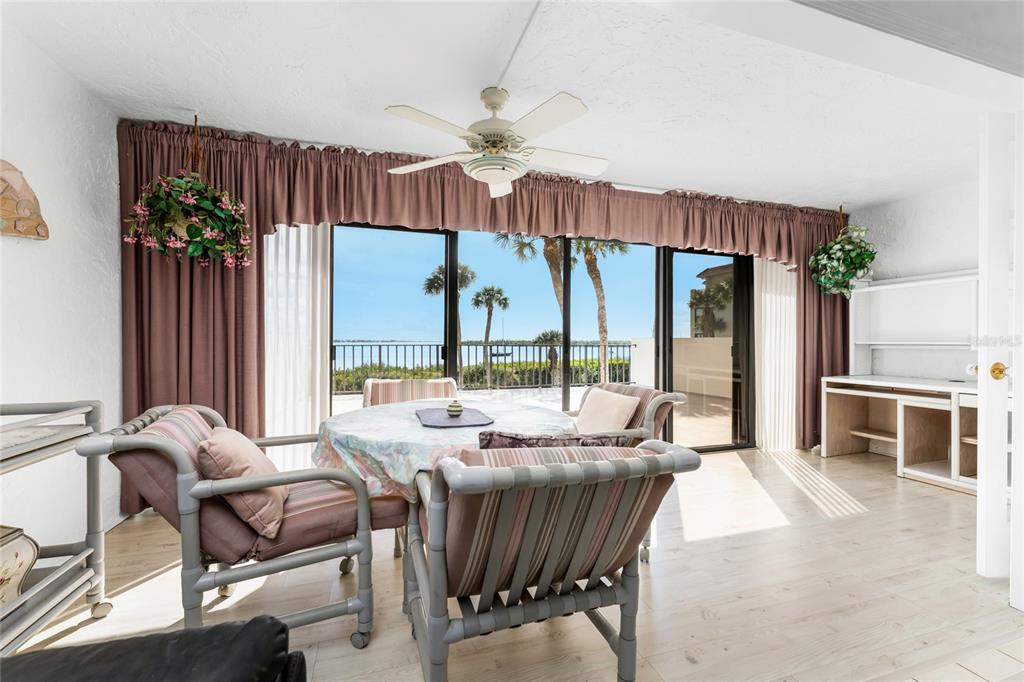 1551 Beach Road, Unit 204 Englewood, FL 34223 - Photo 11 of 55 a view of a dining room with furniture water view and a chandelier