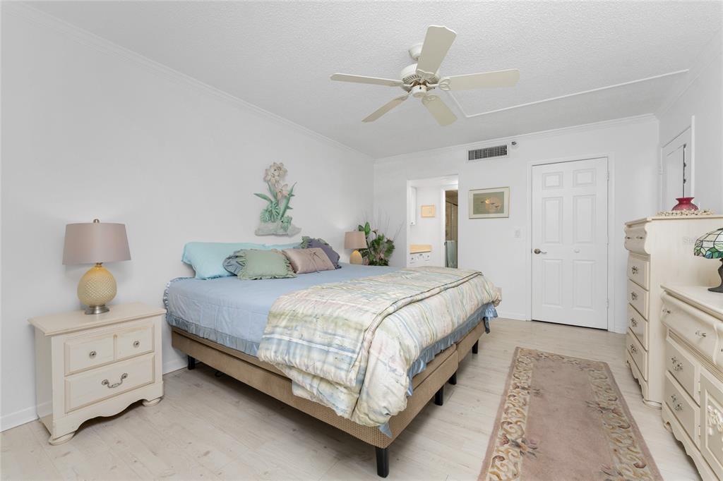1551 Beach Road, Unit 204 Englewood, FL 34223 - Photo 17 of 55 a bedroom with a bed and a chandelier