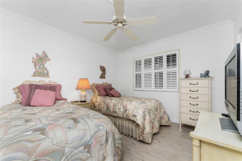 1551 Beach Road, Unit 204 Englewood, FL 34223 - Photo 21 of 55 a bedroom with two beds and a dresser